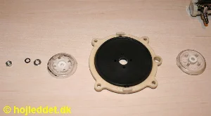 The two support plates that sandwich the diaphragm.